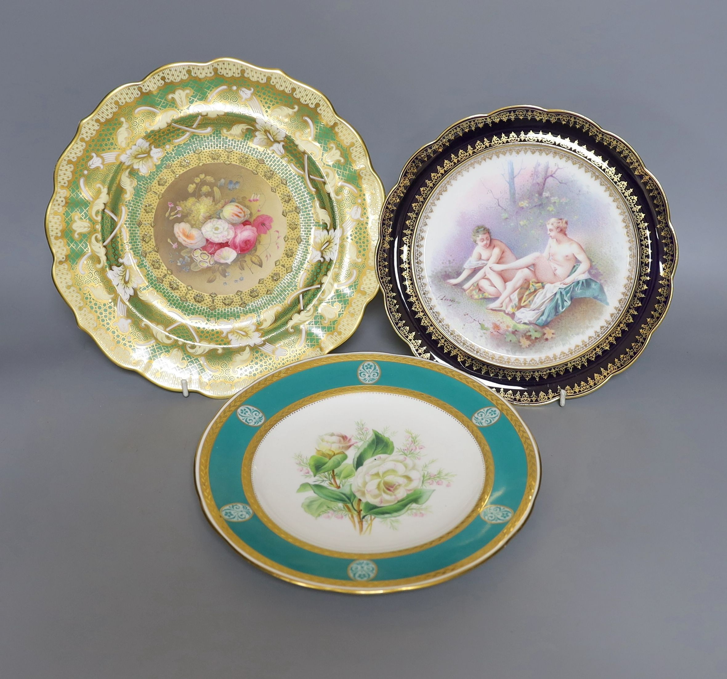 Two 19th century English porcelain flower painted plates, one by Minton and a continental porcelain plate painted with bathers by E Laurent (3)